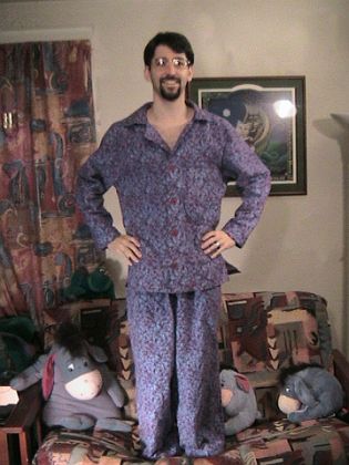 Me, standing on a couch, wearing pyjamas.